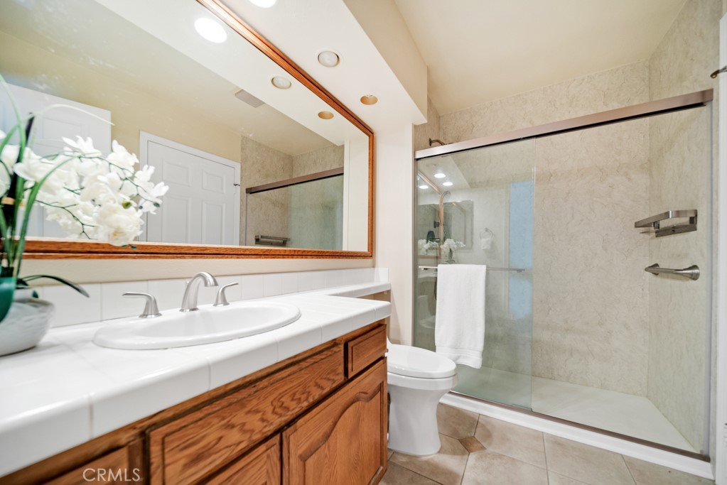 18845 Beechtree Lane Porter Ranch, CA 91326 - Photo 30 of 41 a bathroom with a sink and a mirror