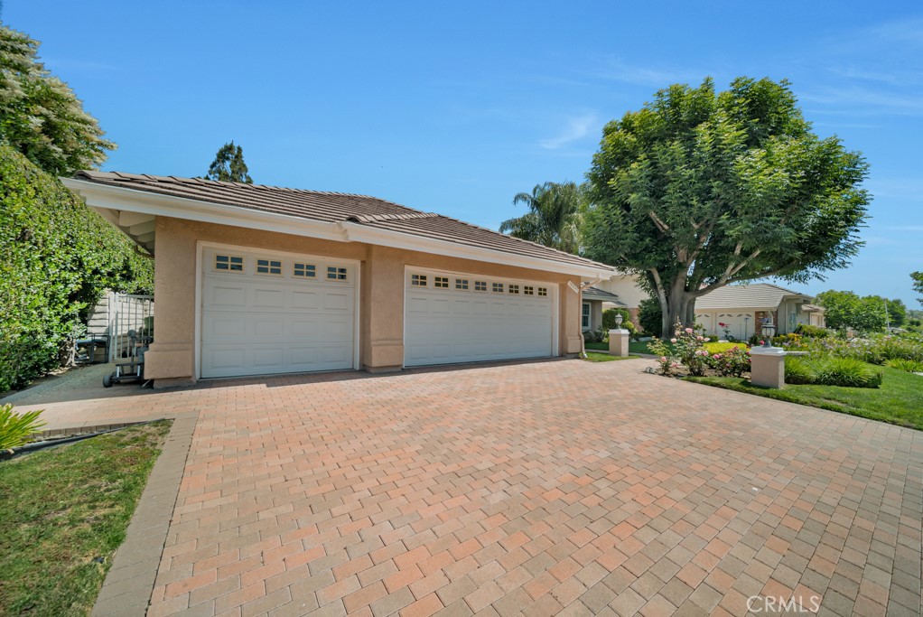 18845 Beechtree Lane Porter Ranch, CA 91326 - Photo 3 of 41 a front view of a house with a yard and garage