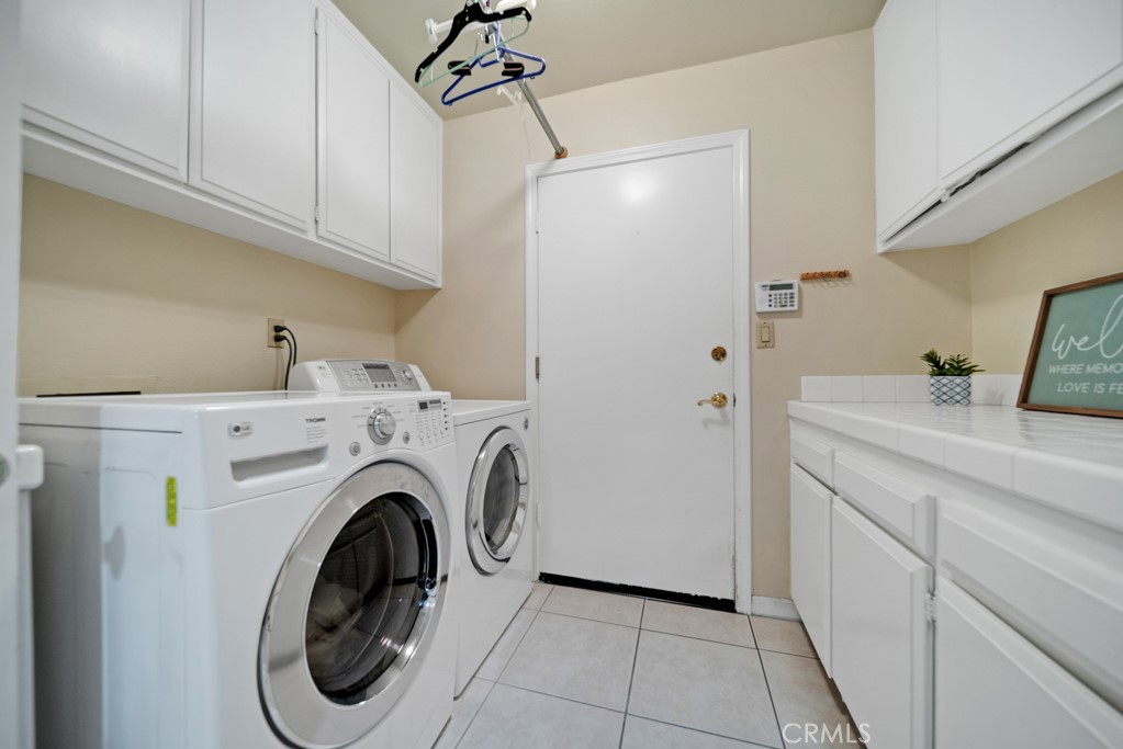 18845 Beechtree Lane Porter Ranch, CA 91326 - Photo 33 of 41 a utility room with dryer and washer