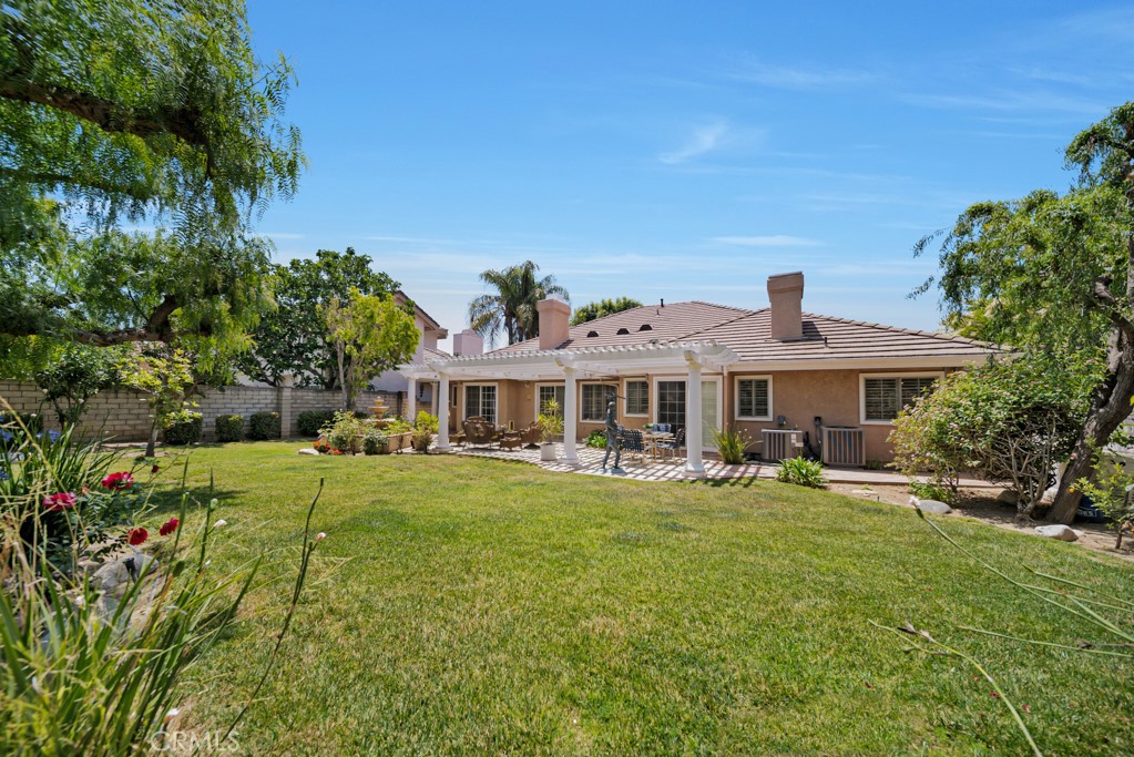 18845 Beechtree Lane Porter Ranch, CA 91326 - Photo 35 of 41 a front view of a house with garden