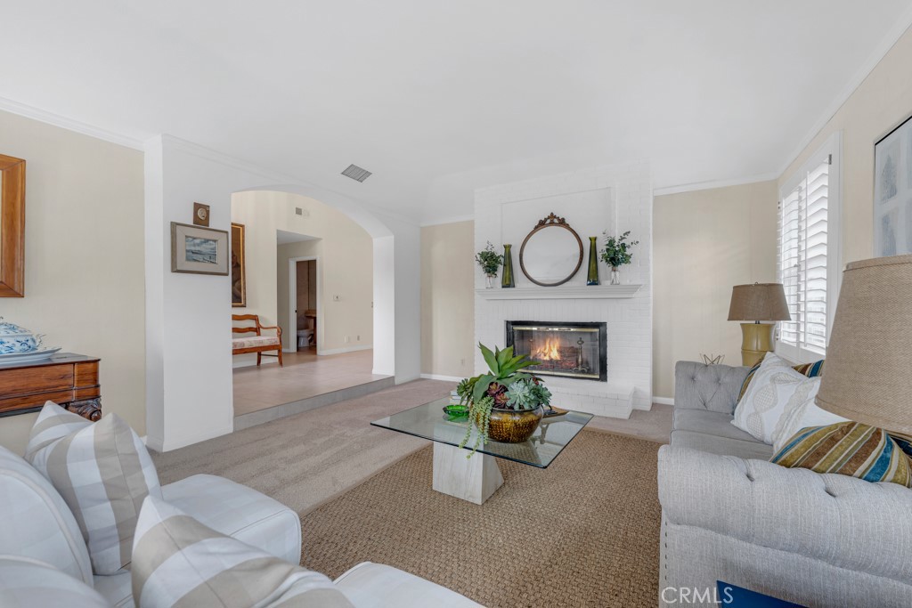 18845 Beechtree Lane Porter Ranch, CA 91326 - Photo 6 of 41 a living room with furniture and a fireplace