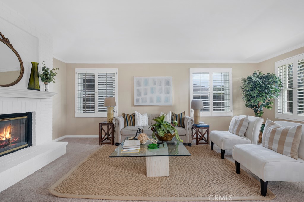 18845 Beechtree Lane Porter Ranch, CA 91326 - Photo 7 of 41 a living room with furniture and a fireplace