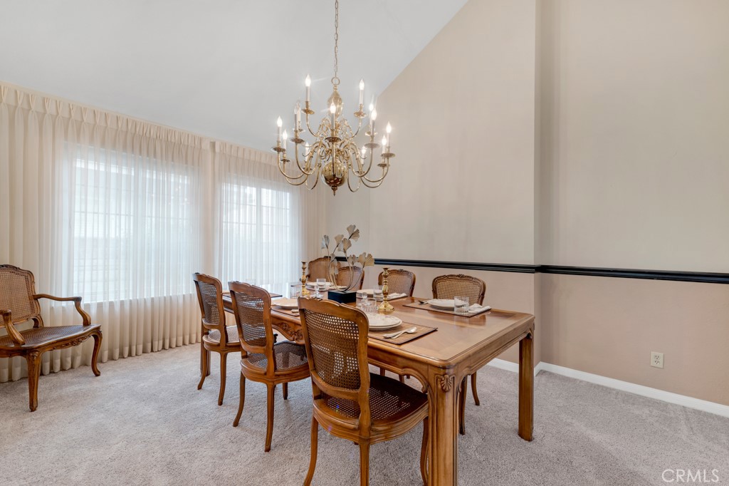 18845 Beechtree Lane Porter Ranch, CA 91326 - Photo 9 of 41 a view of a dining room with furniture and chandelier
