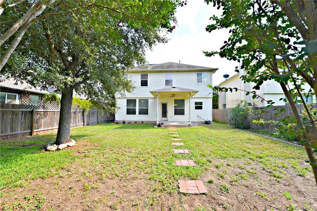 a view of a yard in front of a house