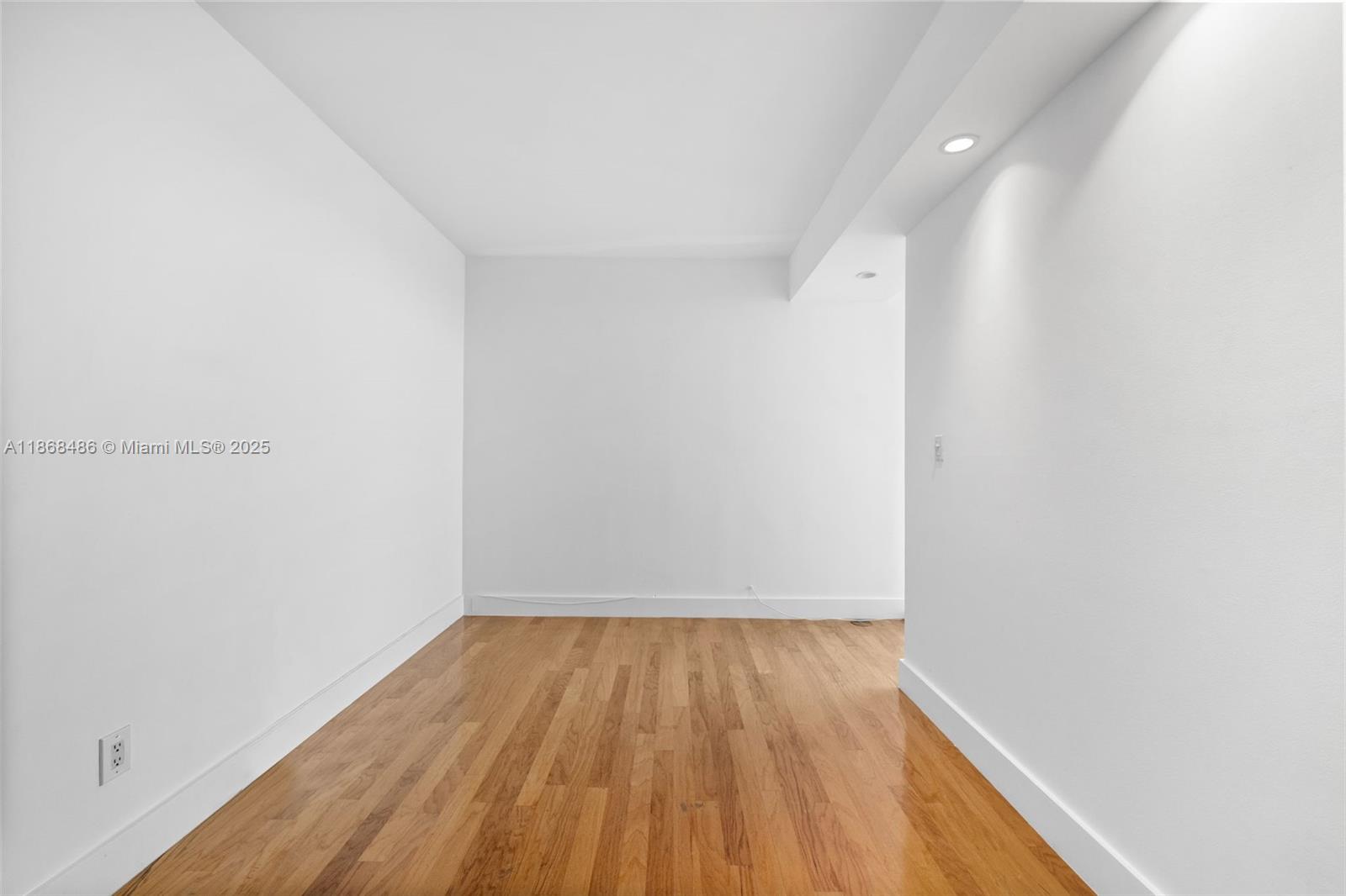 2127 Brickell Avenue, Unit 1504 Miami, FL 33129 - Photo 19 of 44 a view of a room with wooden floor