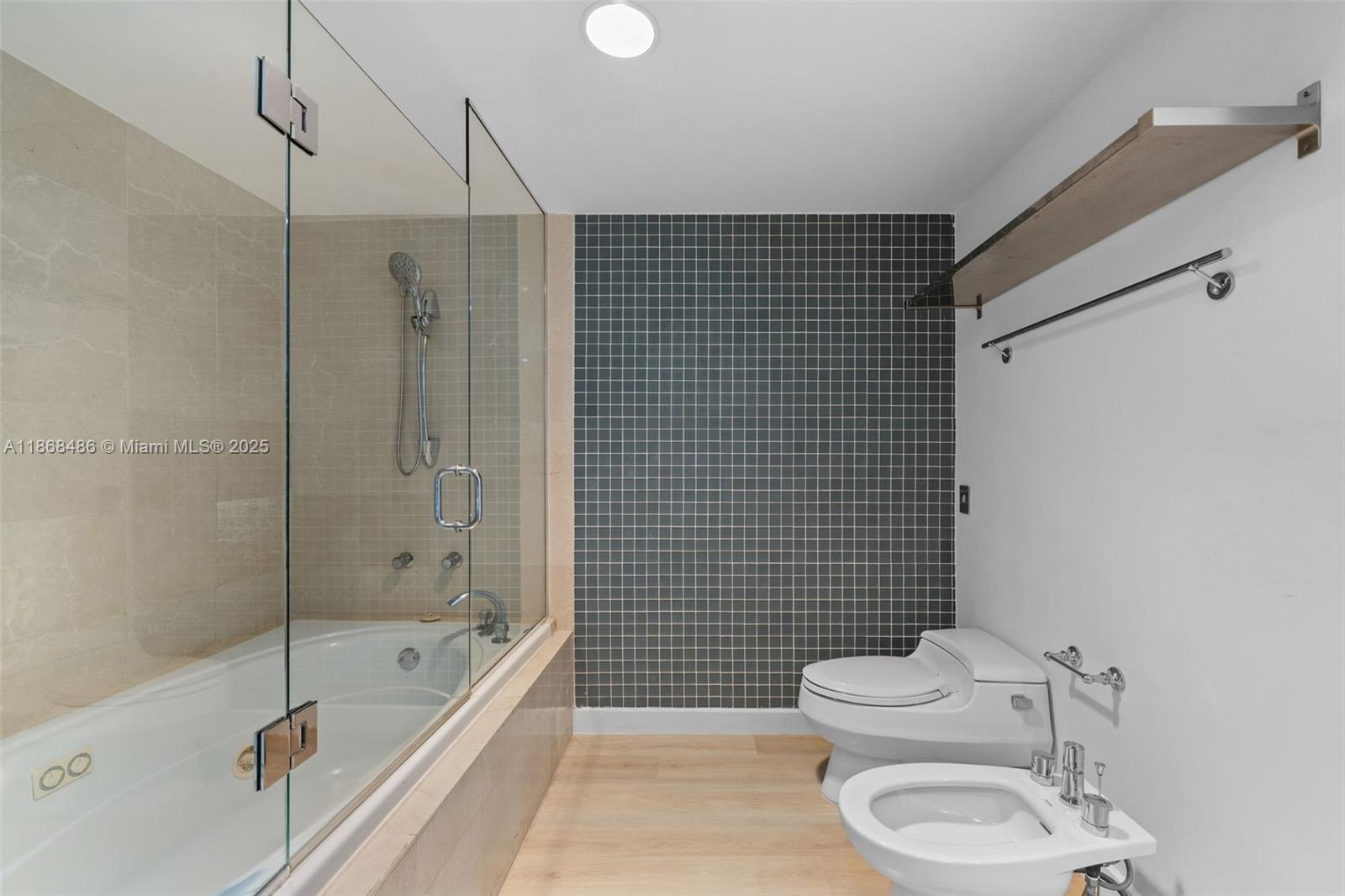 2127 Brickell Avenue, Unit 1504 Miami, FL 33129 - Photo 26 of 44 a bathroom with a toilet a sink and bathtub