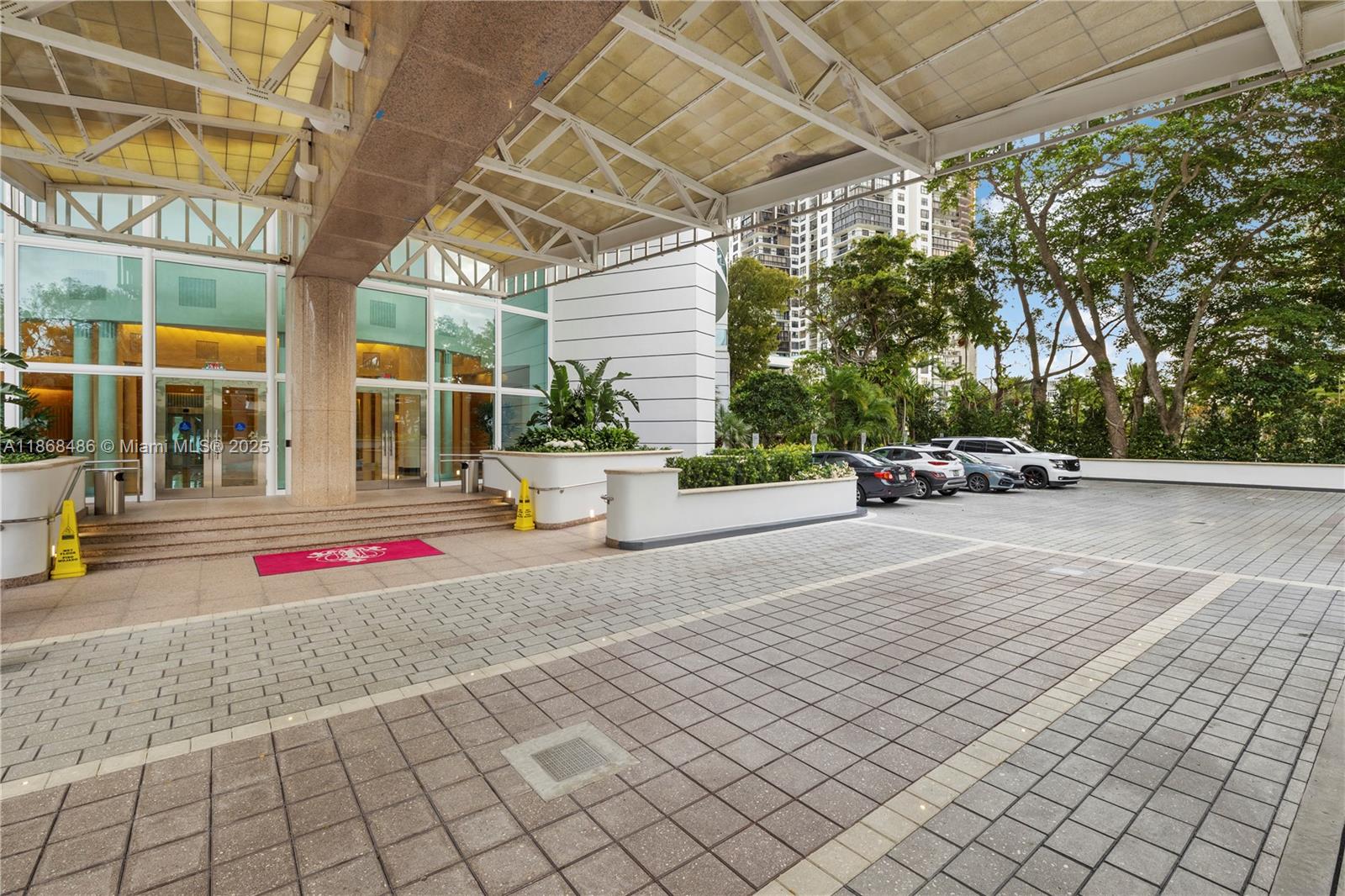 2127 Brickell Avenue, Unit 1504 Miami, FL 33129 - Photo 3 of 44 a building with trees in front of it