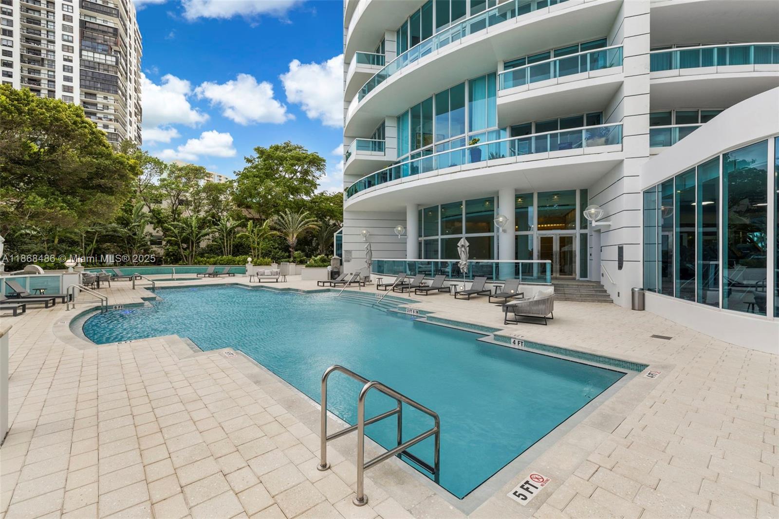 2127 Brickell Avenue, Unit 1504 Miami, FL 33129 - Photo 38 of 44 a view of a house with swimming pool and sitting area