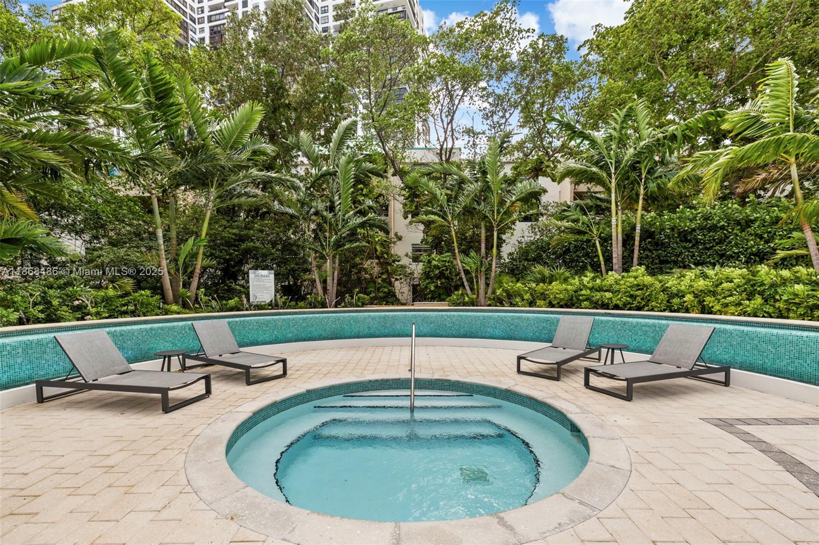 2127 Brickell Avenue, Unit 1504 Miami, FL 33129 - Photo 41 of 44 a view of a swimming pool with outdoor seating