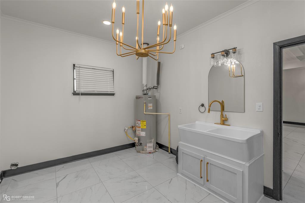 207 Red River Street Benton, LA 71006 - Photo 23 of 29 a bathroom with a sink a light fixture and a mirror