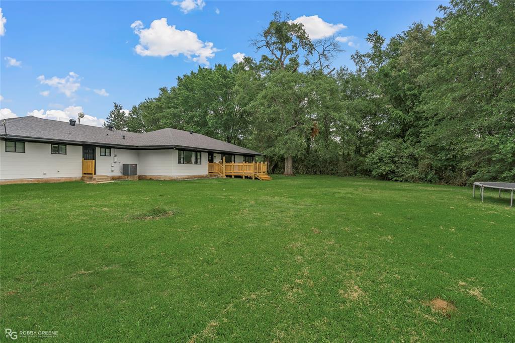 207 Red River Street Benton, LA 71006 - Photo 27 of 29 a house view with a garden space