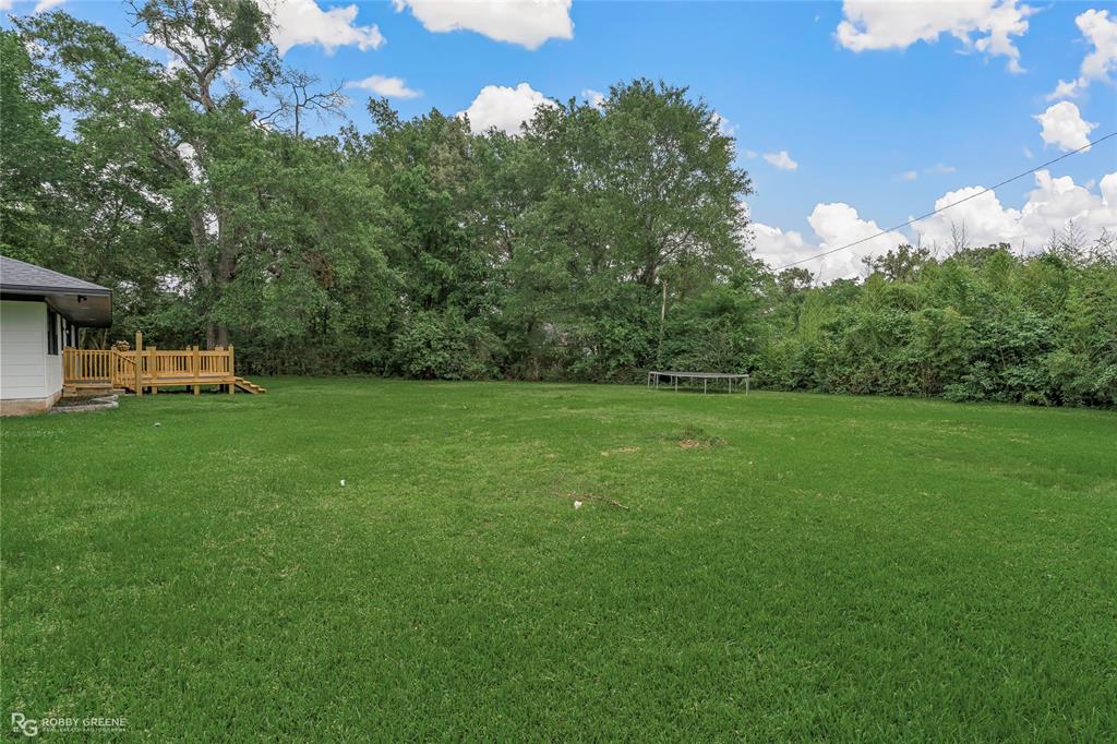207 Red River Street Benton, LA 71006 - Photo 28 of 29 a view of a house with a backyard
