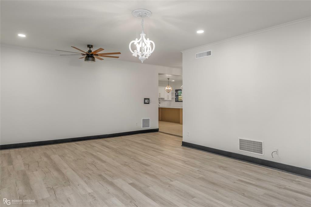 207 Red River Street Benton, LA 71006 - Photo 6 of 29 wooden floor in an empty room with a window