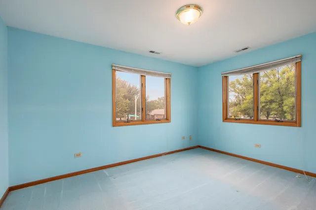 an empty room with windows