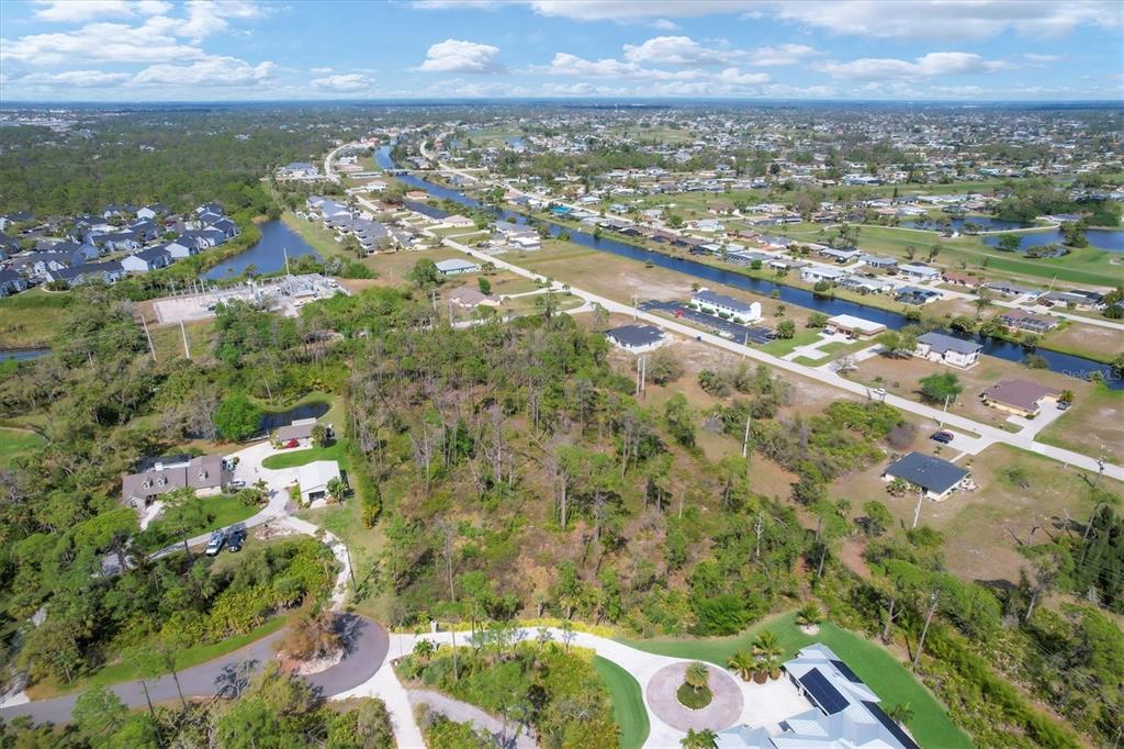 9232 Spring Valley Road Englewood, FL 34224 - Photo 13 of 21 an aerial view of residential houses with outdoor space