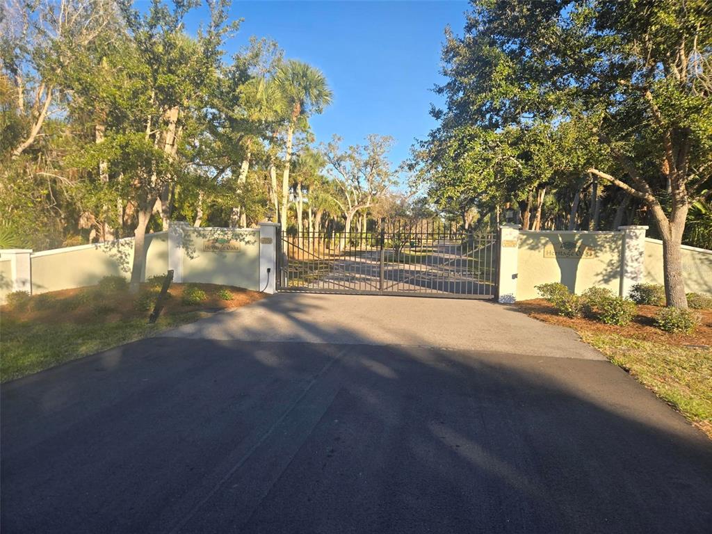 9232 Spring Valley Road Englewood, FL 34224 - Photo 21 of 21 a view of road with large trees