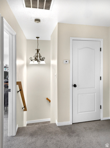 802 Sugar Maple Court Payson, UT 84651 - Photo 13 of 30 Stairway with carpet and hanging lights