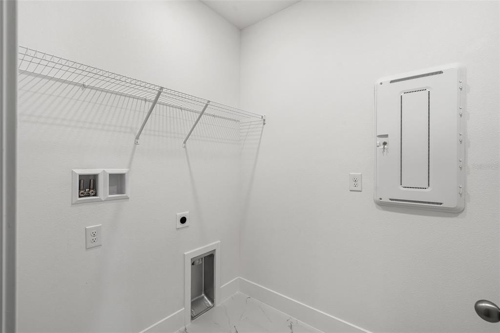 2438 Magnolia Reserve Road Ocoee, FL 34761 - Photo 18 of 26 a bathroom with a shower curtain and a sink