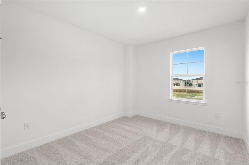 2438 Magnolia Reserve Road Ocoee, FL 34761 - Photo 20 of 26 an empty room with a window