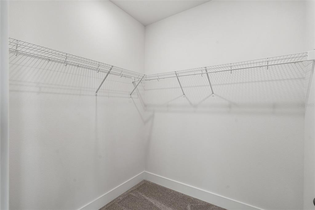 2438 Magnolia Reserve Road Ocoee, FL 34761 - Photo 25 of 26 a view of a room with racks on the wall