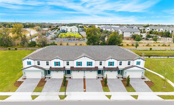a view of residential houses with outdoor space and ocean view