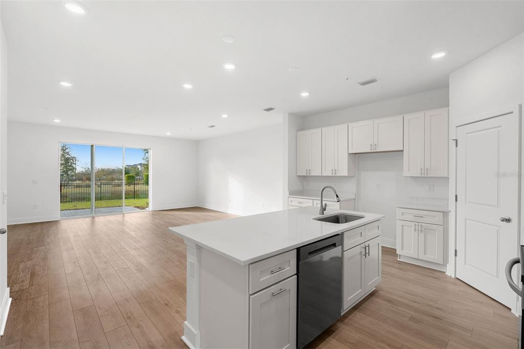 2438 Magnolia Reserve Road Ocoee, FL 34761 - Photo 6 of 26 a kitchen with a sink stove and cabinets