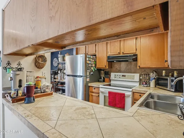 a bathroom with a sink mirror and toilet