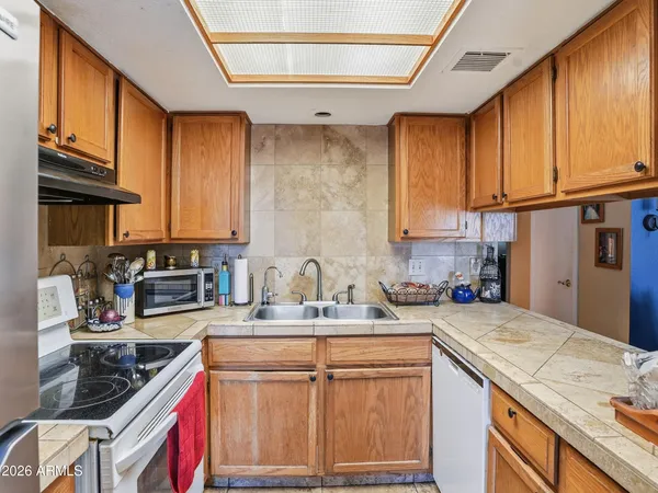 a bedroom with a bed and large window