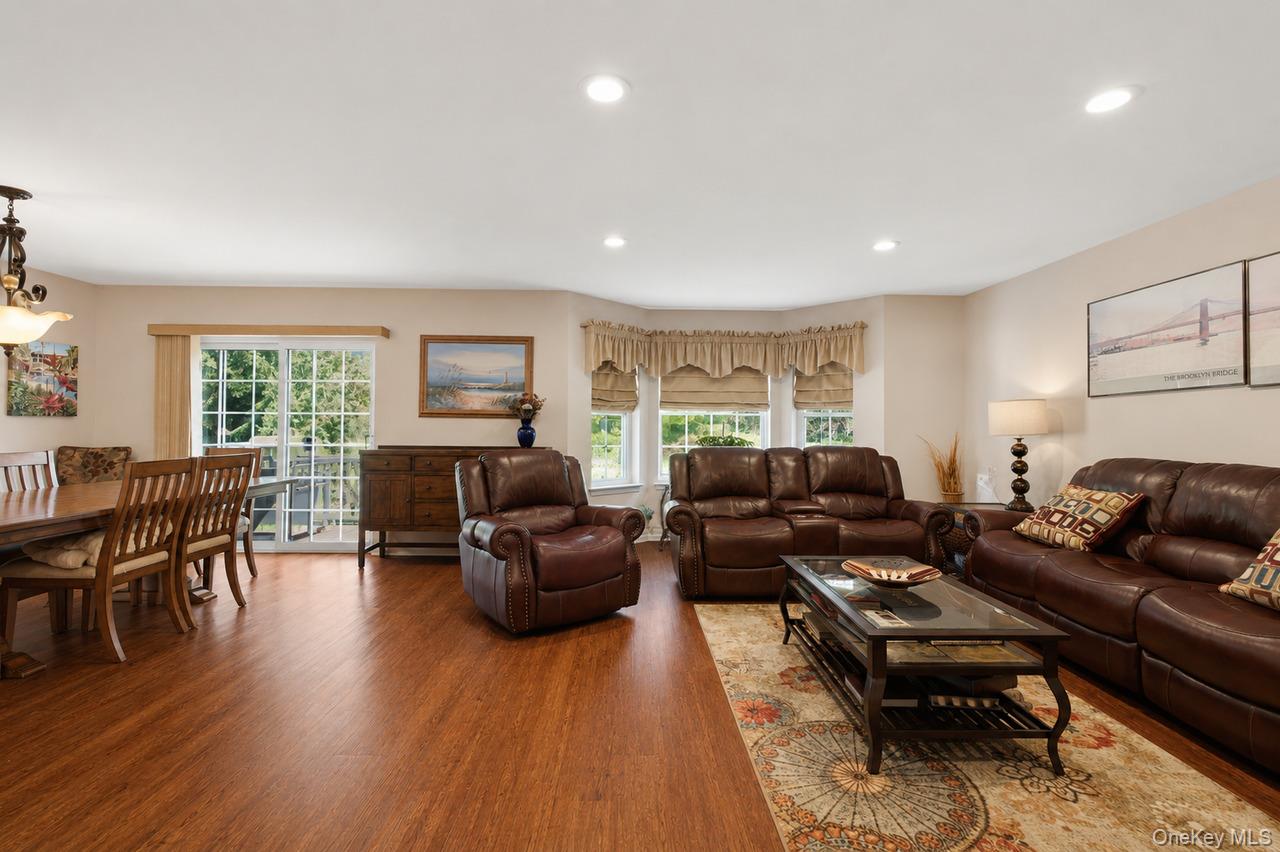 64 Roma Orchard Road Peekskill, NY 10566 - Photo 16 of 40 Expansive living area featuring warm wood-finish flooring throughout