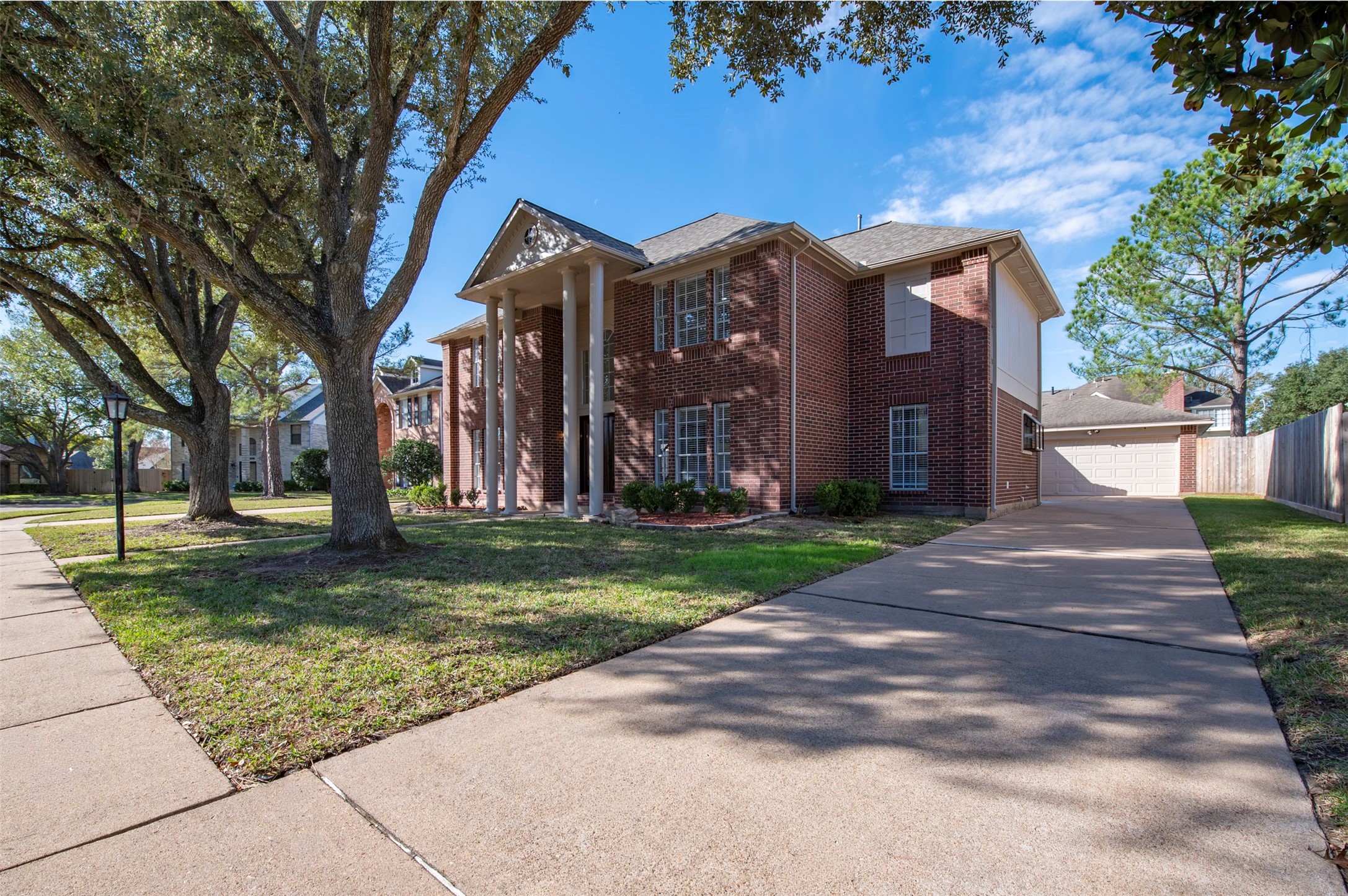 11434 High Bridge Court Houston, TX 77065 - Photo 2 of 31 a view of a house with a yard
