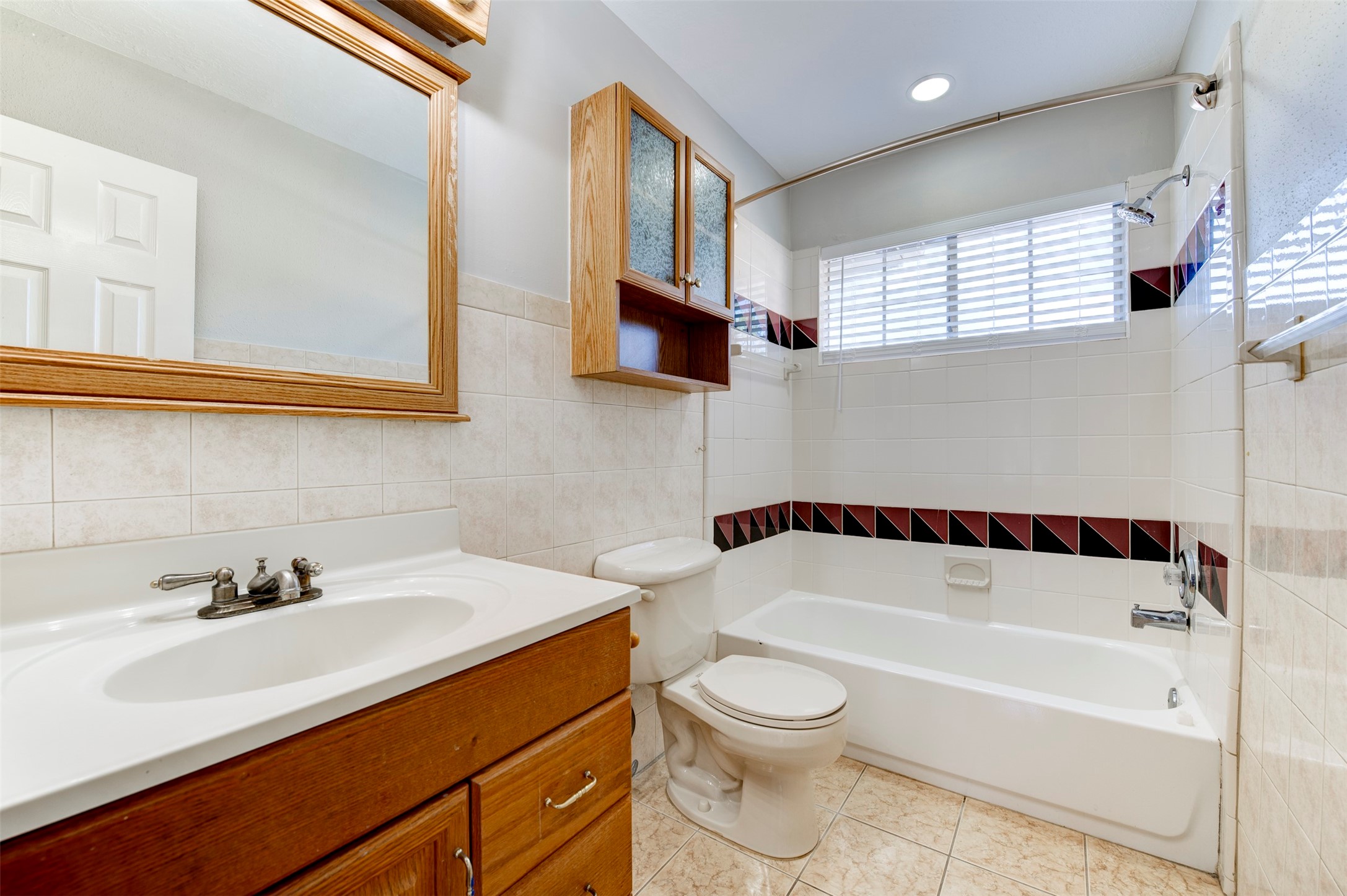 11434 High Bridge Court Houston, TX 77065 - Photo 22 of 31 a bathroom with a sink a toilet and a bathtub