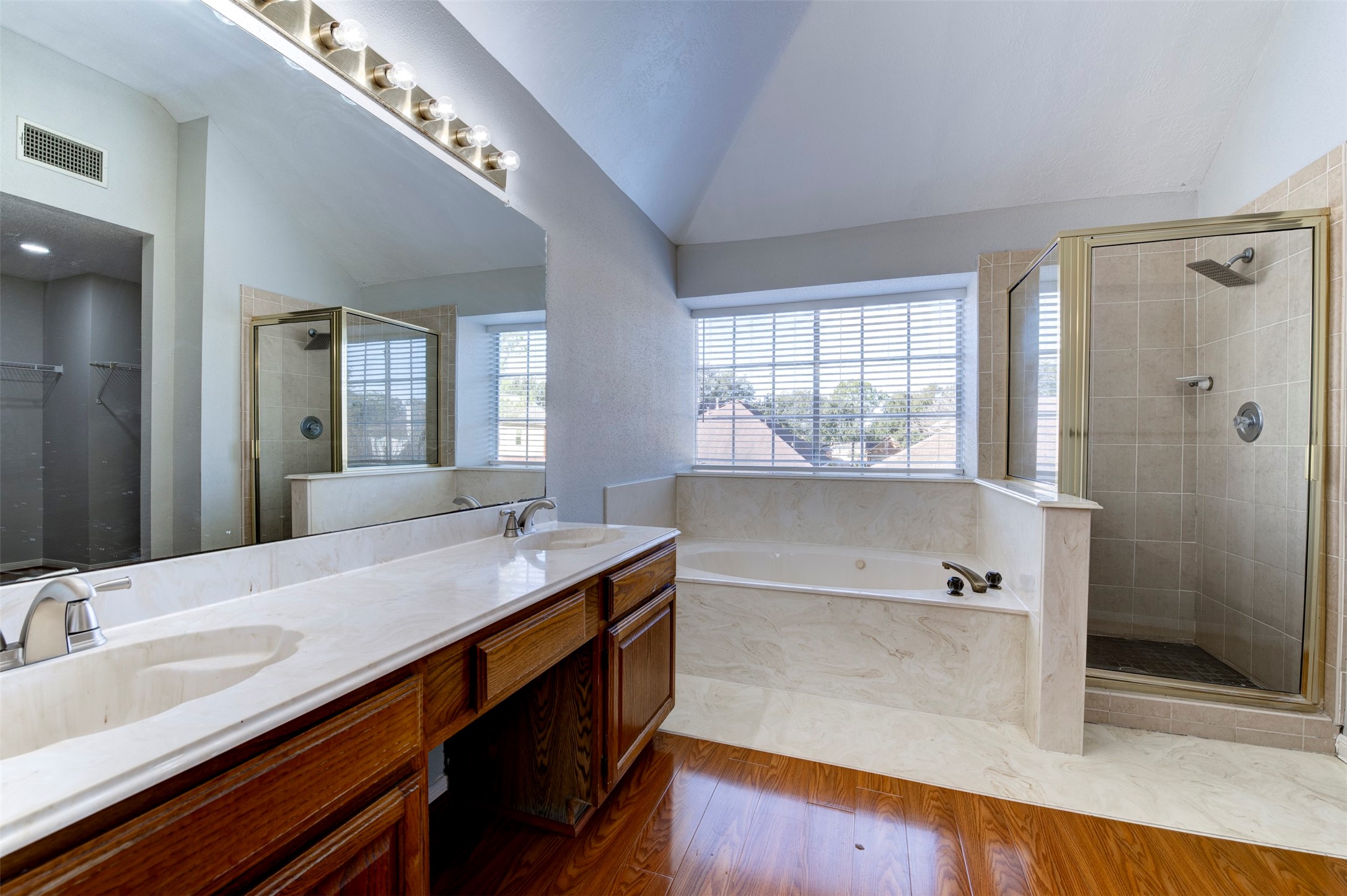 11434 High Bridge Court Houston, TX 77065 - Photo 27 of 31 a bathroom with a tub sink and mirror