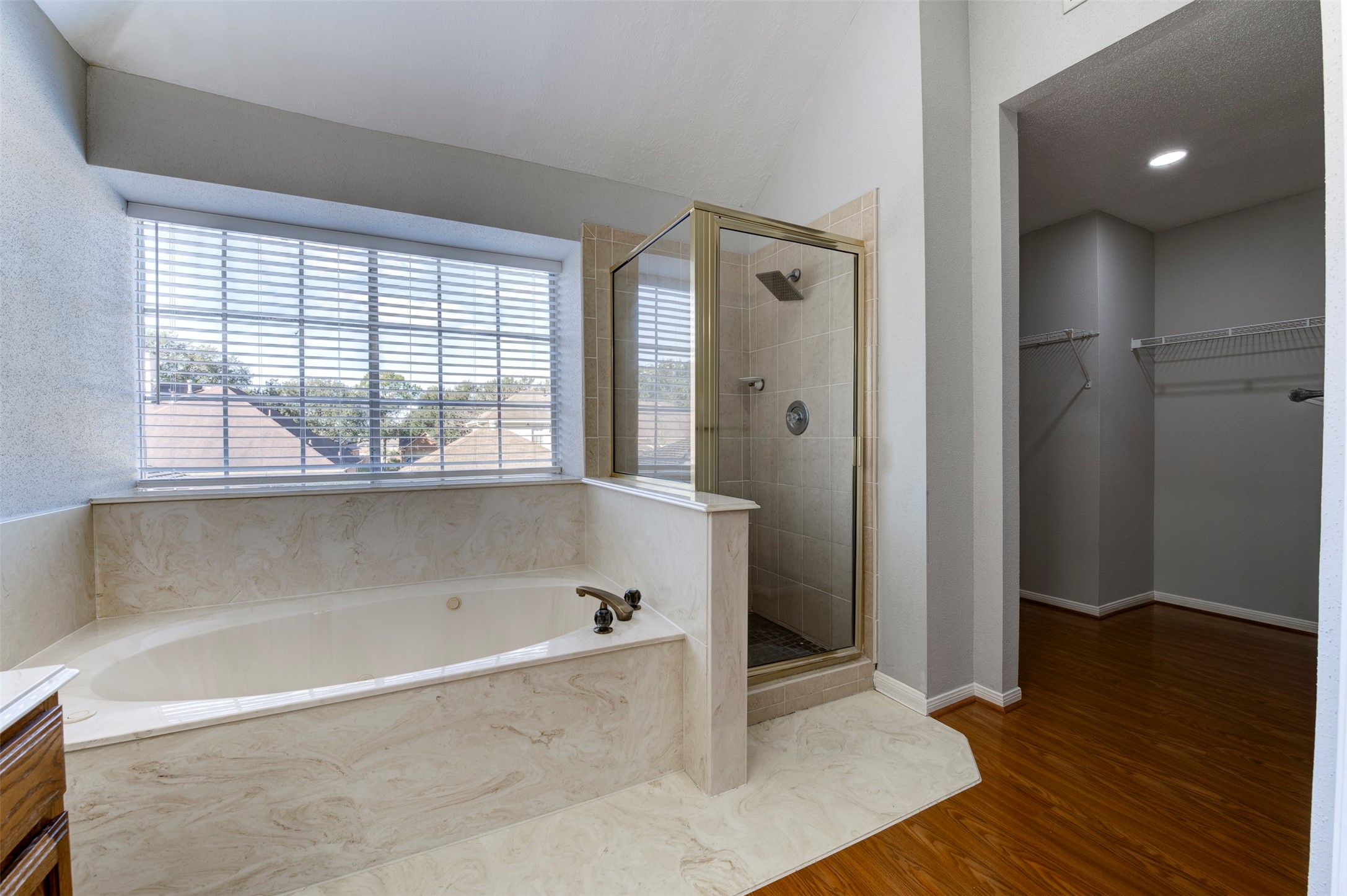 11434 High Bridge Court Houston, TX 77065 - Photo 28 of 31 a bathroom with a bathtub and a shower