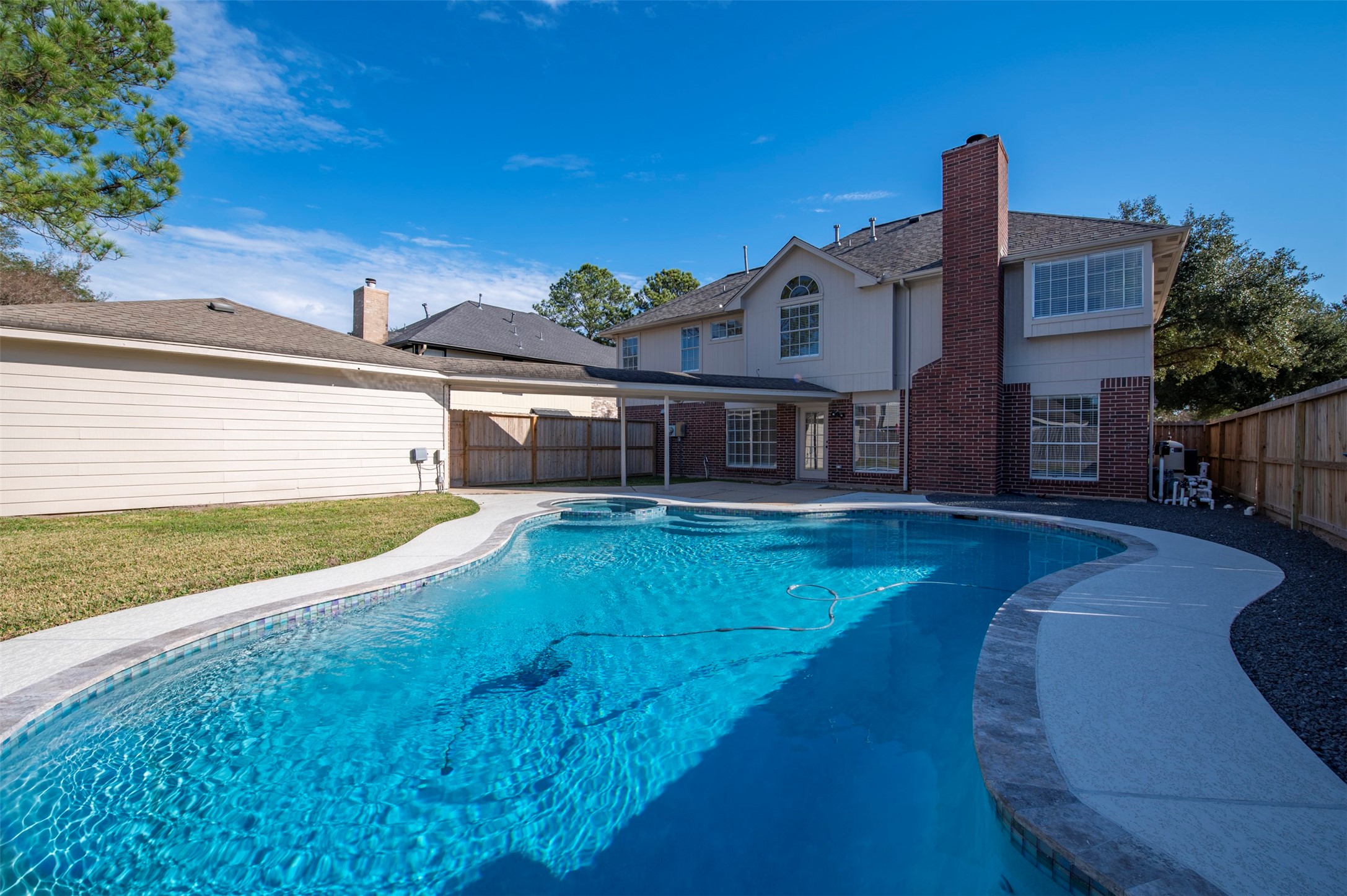 11434 High Bridge Court Houston, TX 77065 - Photo 30 of 31 a view of a house with swimming pool in front of it