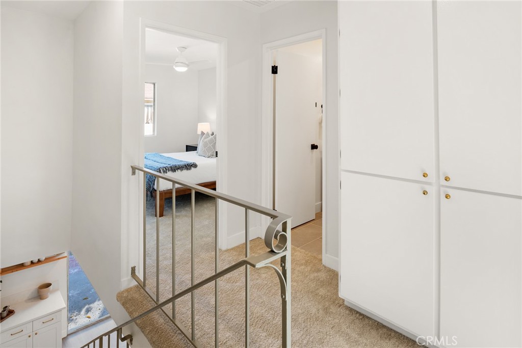 10353 Carefree Drive Santee, CA 92071 - Photo 9 of 27 a view of a hallway with white walls and stairs