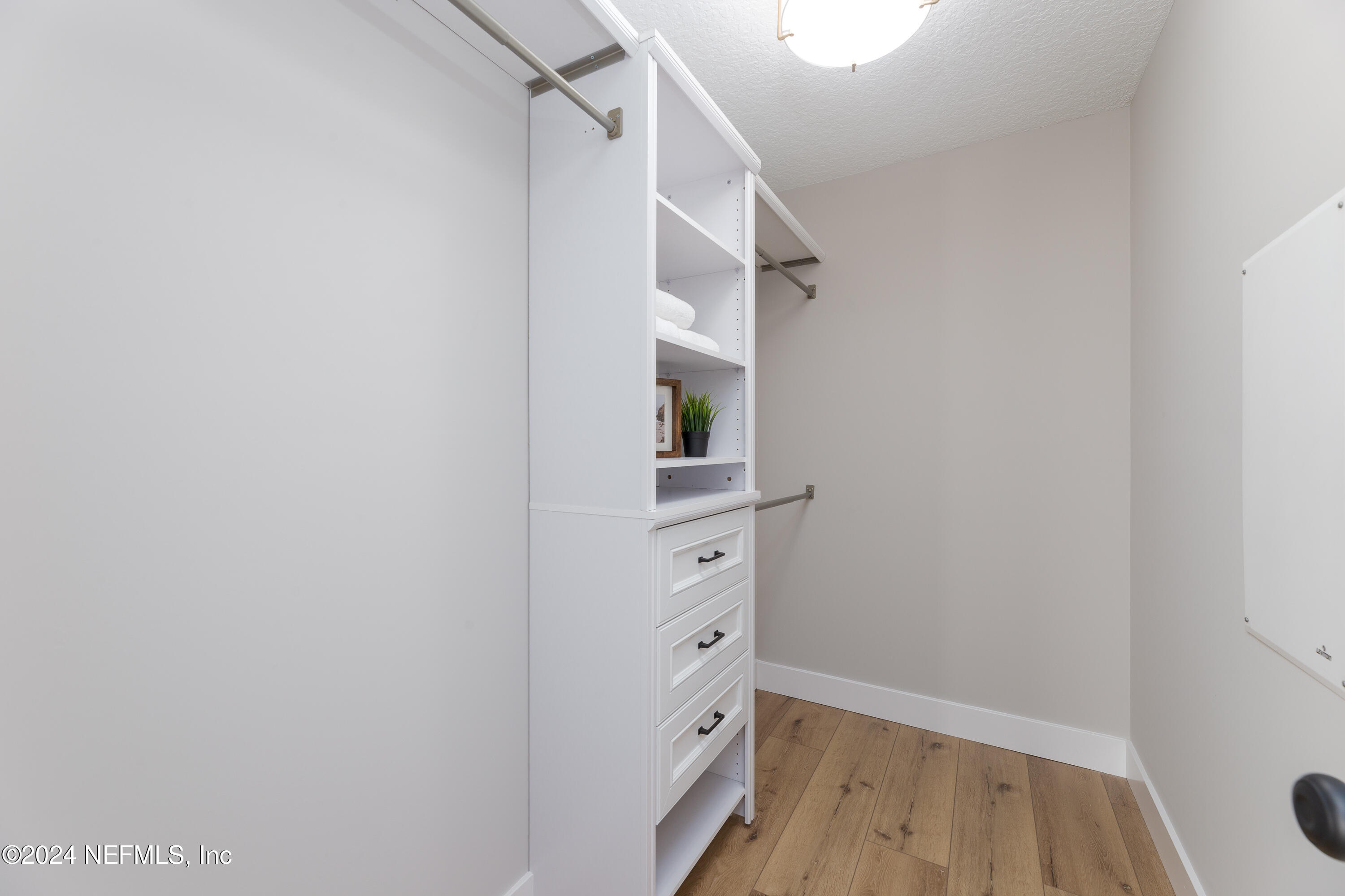 9542 Staples Mill Drive Jacksonville, FL 32244 - Photo 22 of 33 a view of walk in closet