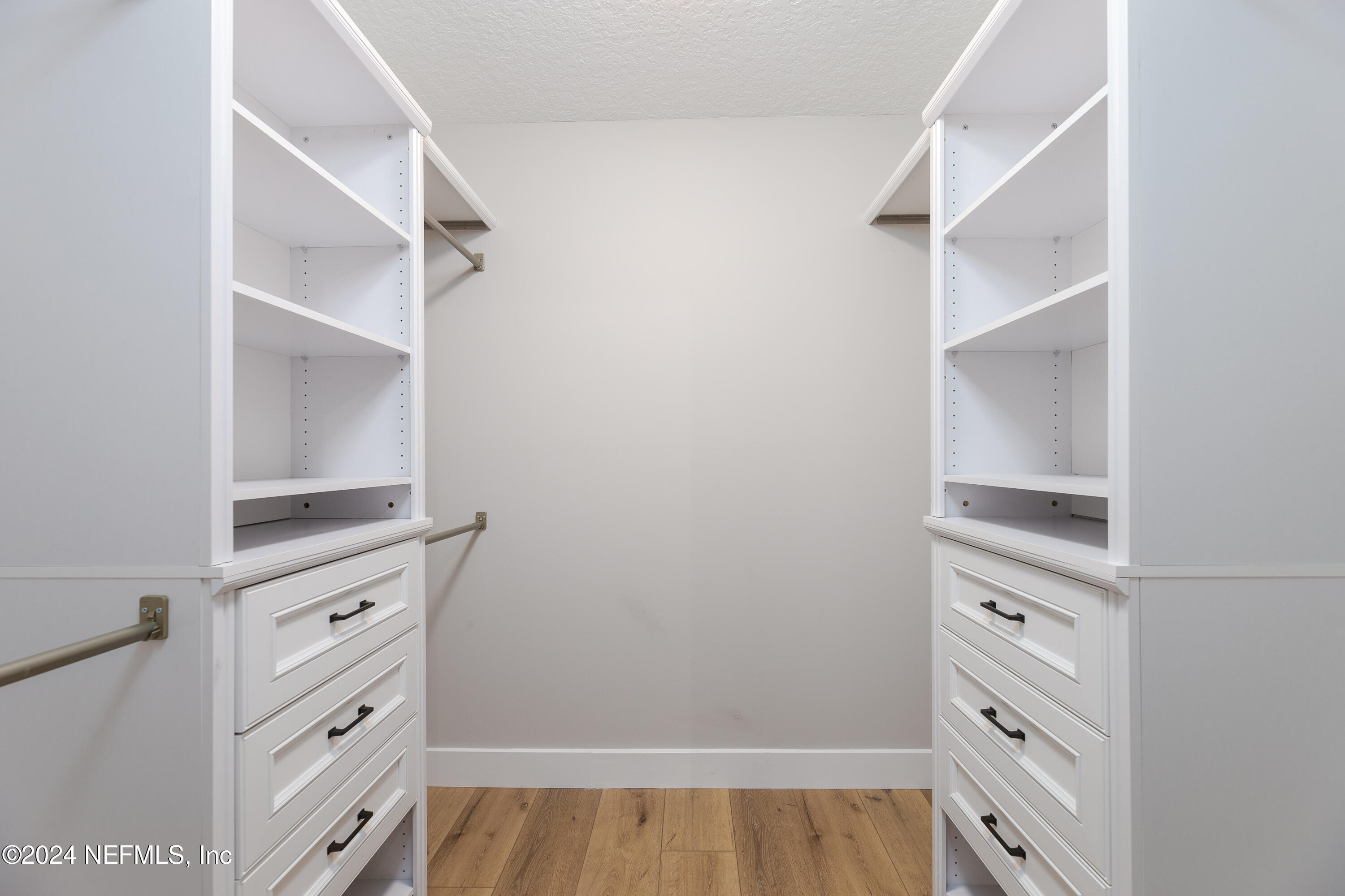 9542 Staples Mill Drive Jacksonville, FL 32244 - Photo 25 of 33 a view of an empty walk in closet