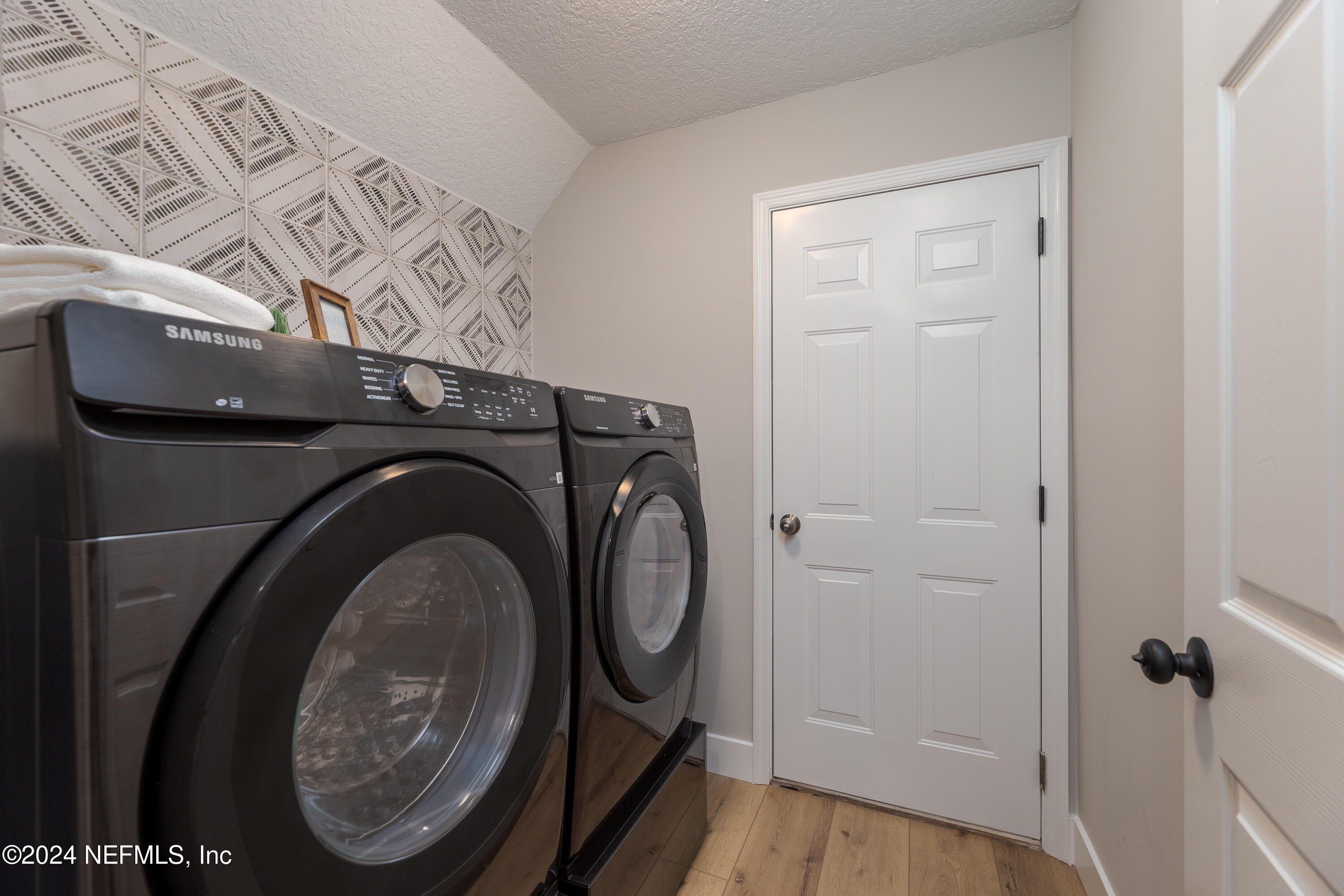 9542 Staples Mill Drive Jacksonville, FL 32244 - Photo 28 of 33 a view of an entryway with washer and dryer