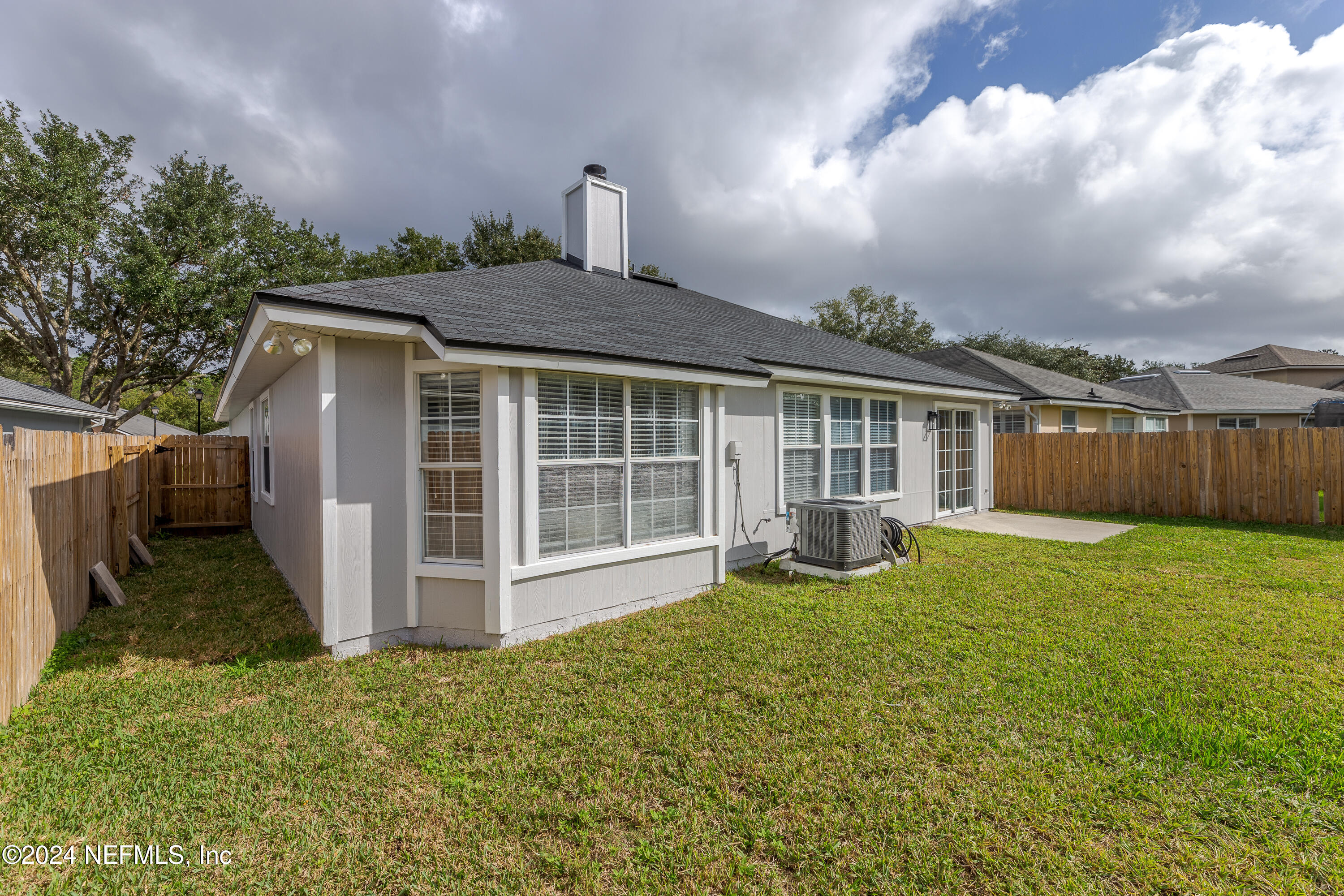 9542 Staples Mill Drive Jacksonville, FL 32244 - Photo 29 of 33 a view of a house with a yard