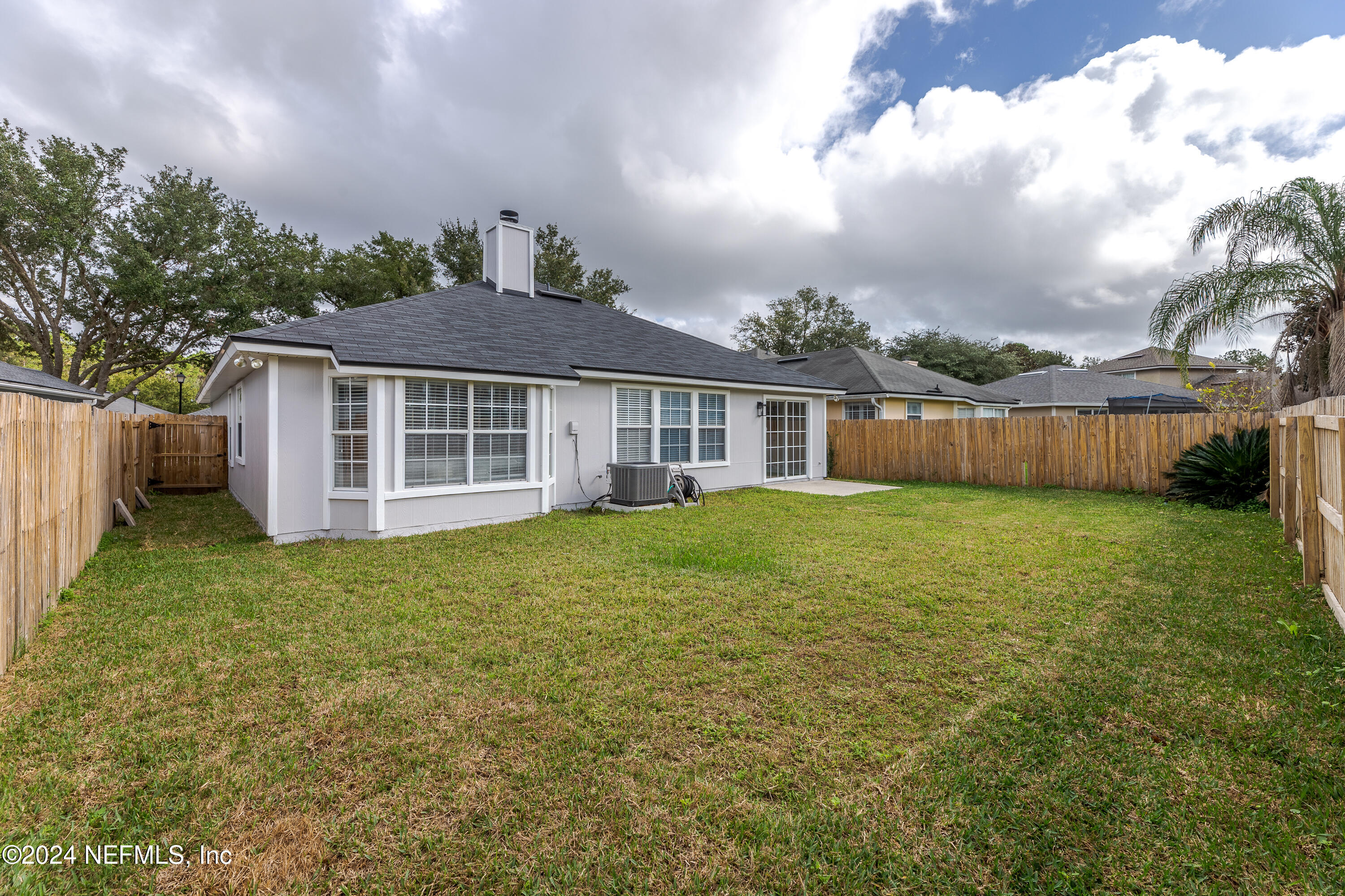9542 Staples Mill Drive Jacksonville, FL 32244 - Photo 30 of 33 a front view of a house with a garden