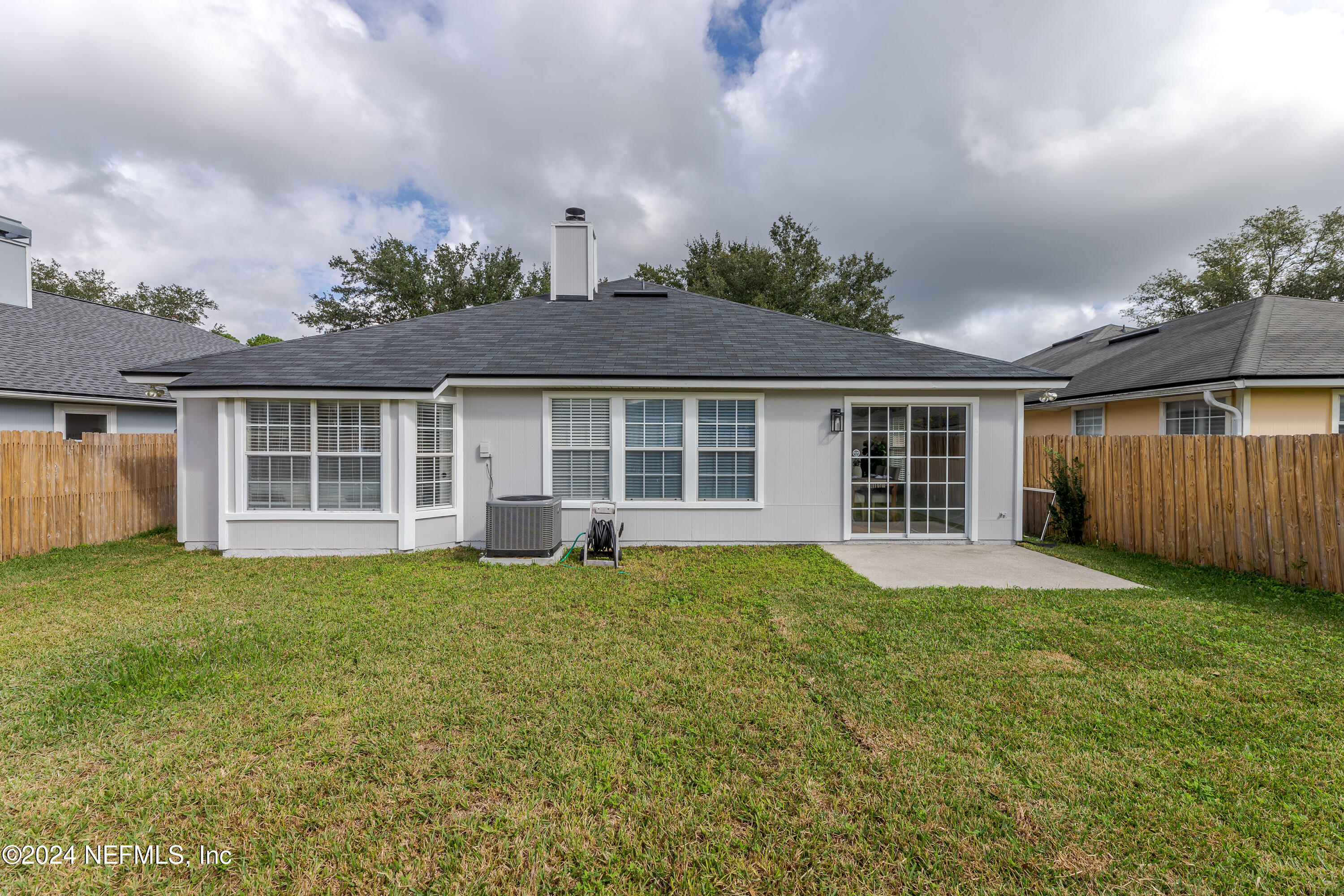 9542 Staples Mill Drive Jacksonville, FL 32244 - Photo 31 of 33 front view of a house with a yard