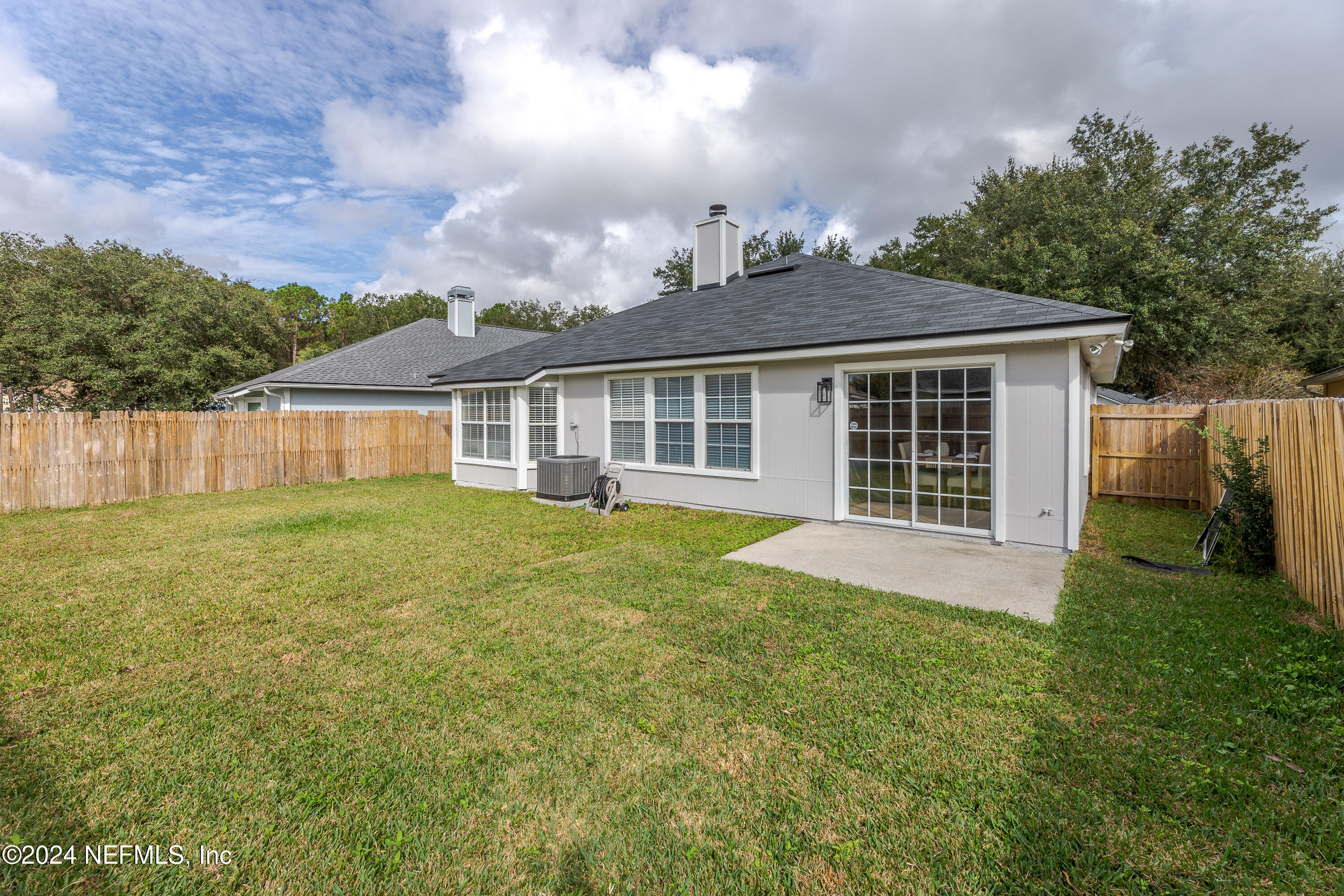 9542 Staples Mill Drive Jacksonville, FL 32244 - Photo 32 of 33 front view of a house with a yard