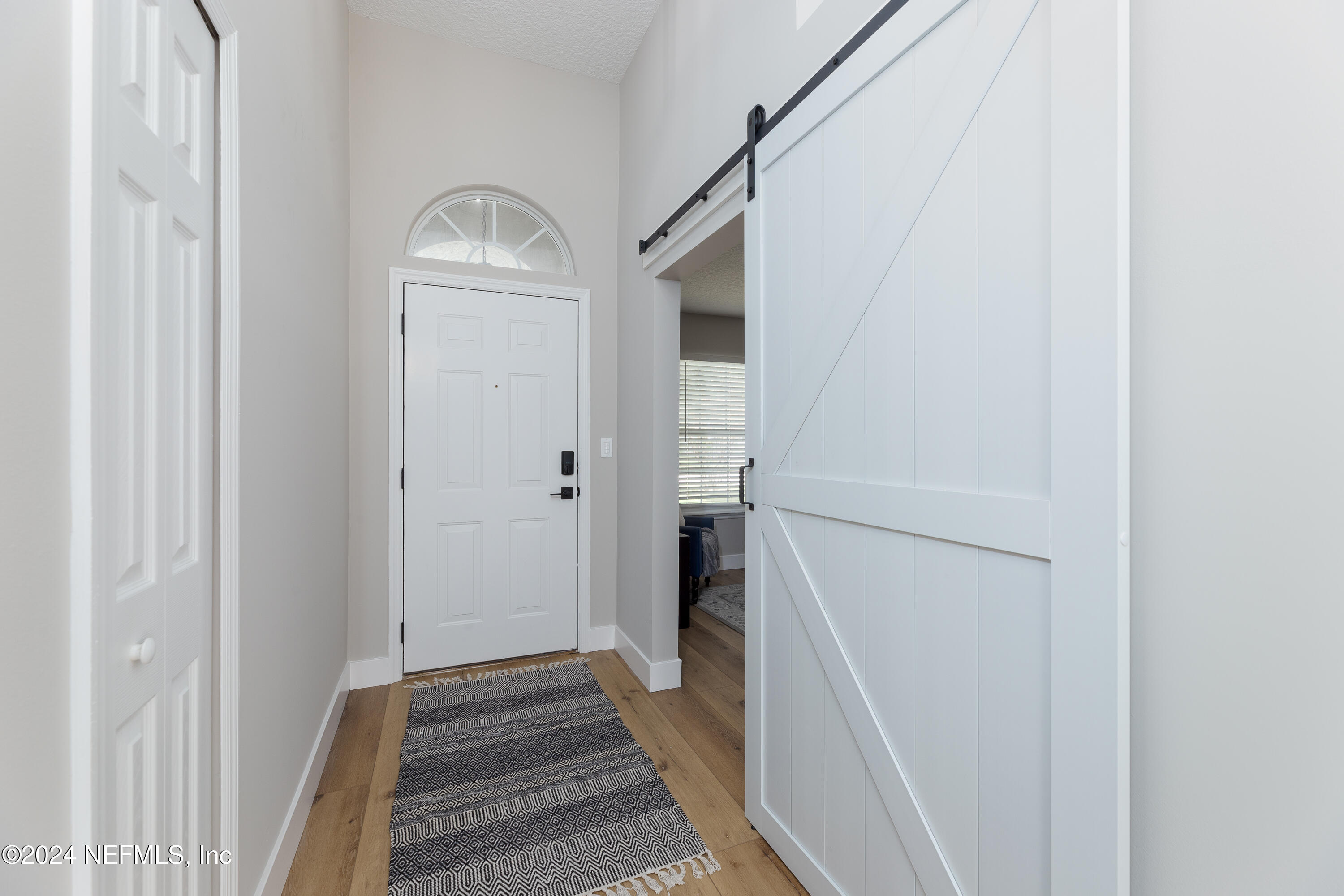 9542 Staples Mill Drive Jacksonville, FL 32244 - Photo 6 of 33 a view of entryway with wooden floor
