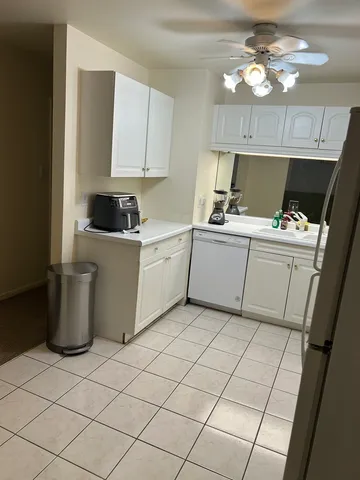 a kitchen with stainless steel appliances a stove a refrigerator sink and cabinets