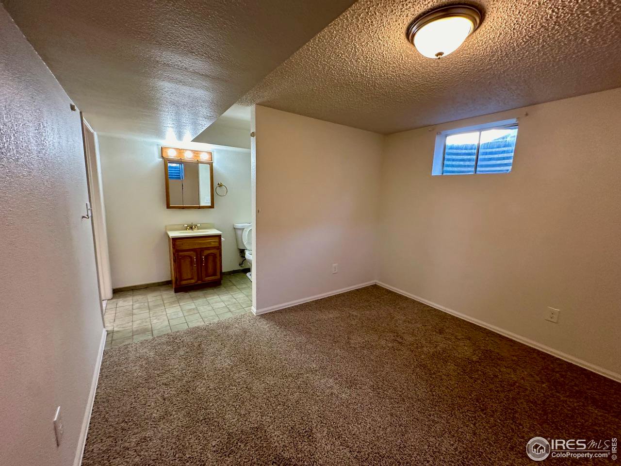 3209 5th Road Greeley, CO 80634 - Photo 27 of 37 an empty room with windows