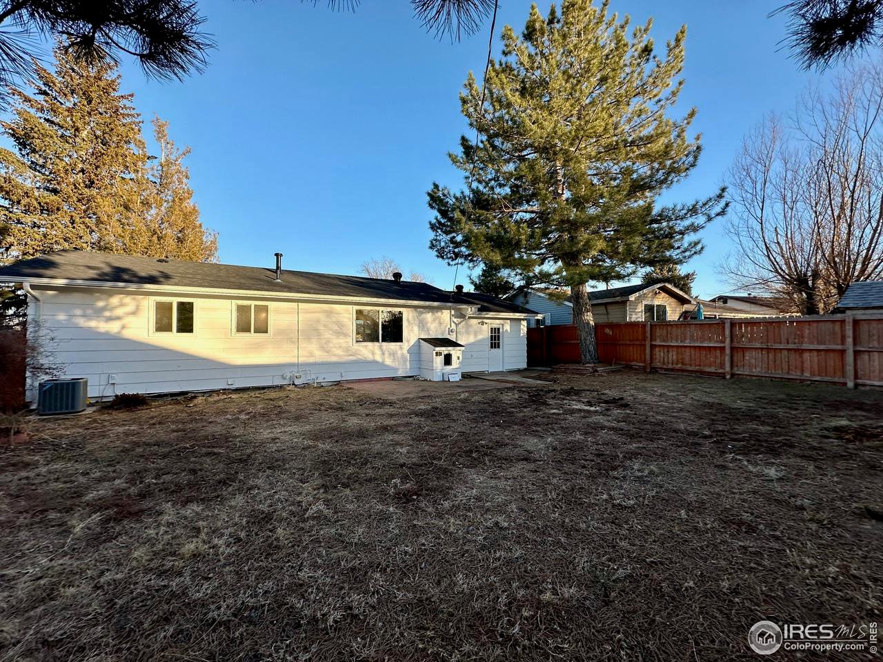 3209 5th Road Greeley, CO 80634 - Photo 32 of 37 a front view of a house with a garden