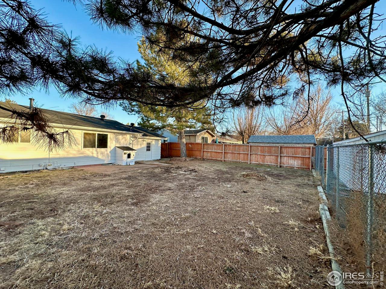 3209 5th Road Greeley, CO 80634 - Photo 34 of 37 a front view of a house with a yard