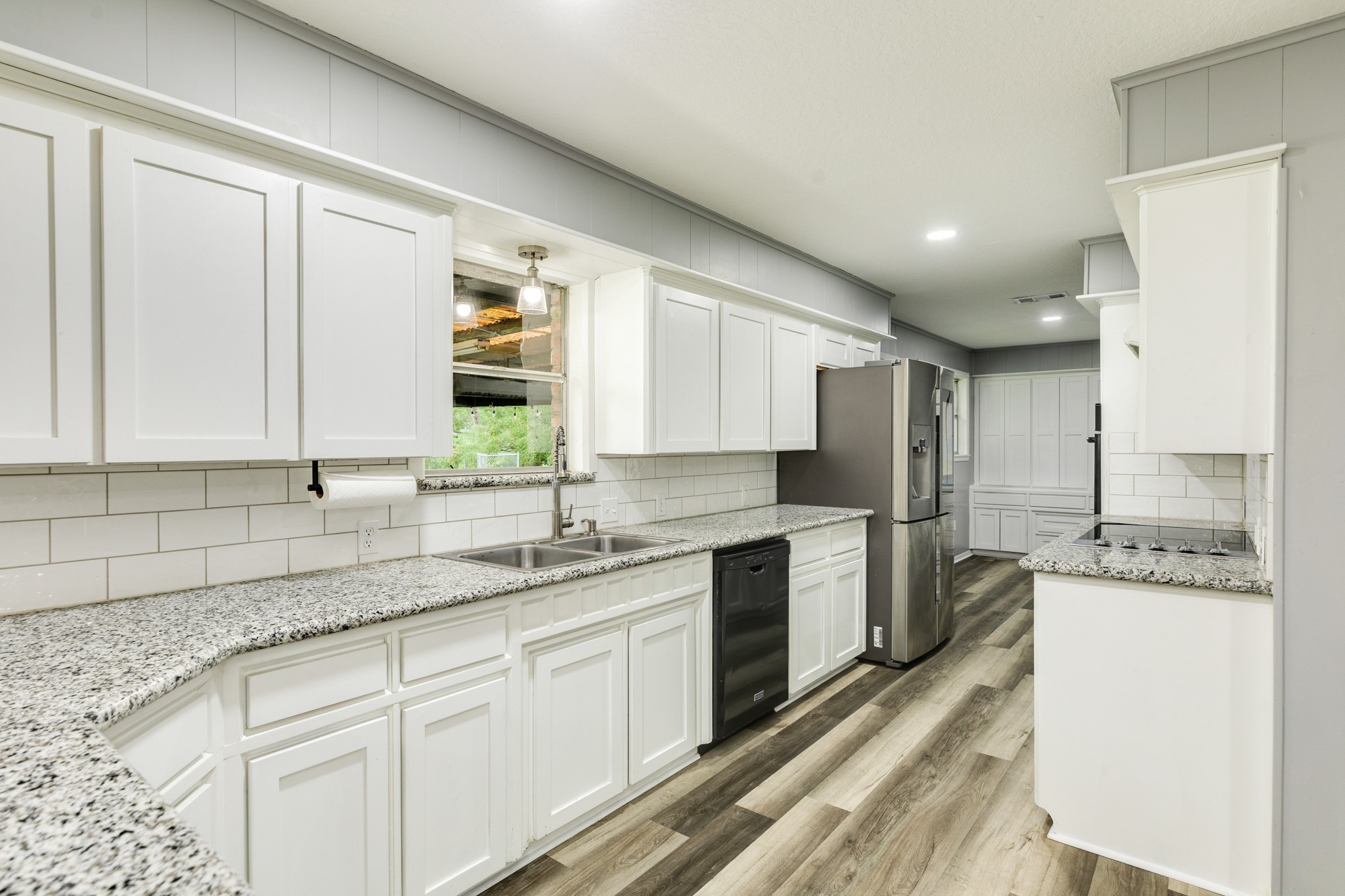 908 West Mulberry Street Angleton, TX 77515 - Photo 9 of 22 a kitchen with a sink stove and cabinets