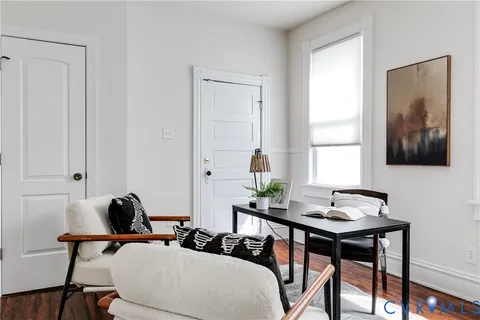 a workspace with furniture and window