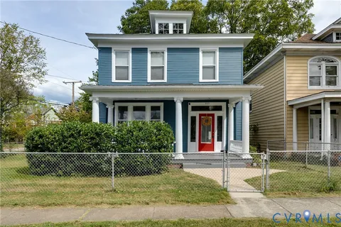 front view of a house that has a yard